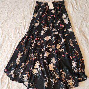 Lovely flowy black hi-low floral skirt. Wrap-style with tie.